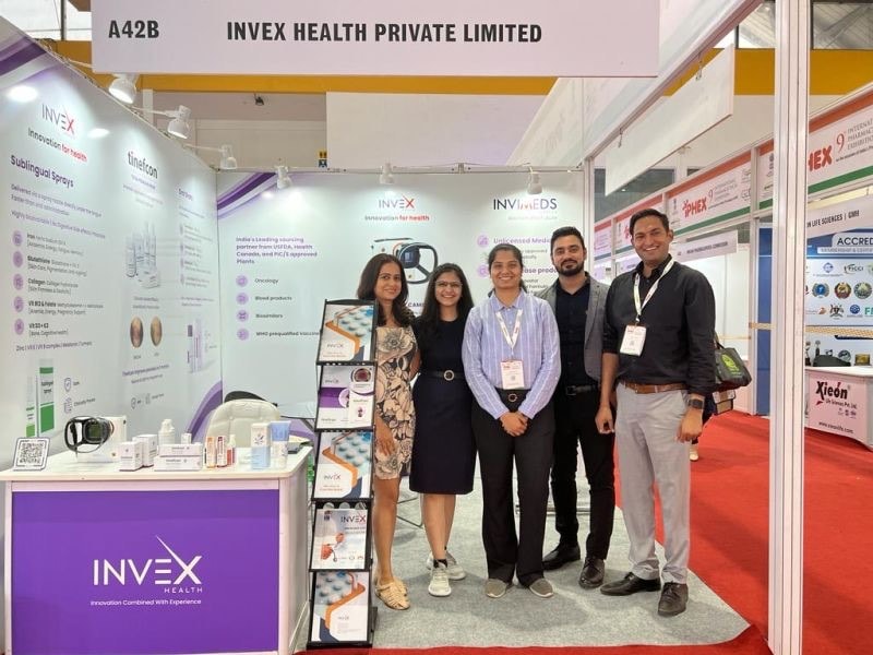 The Invex Health team standing together at their IPHEX exhibition stand